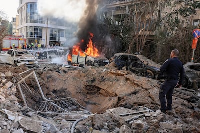 Emergency personnel respond at the site of an Iranian missile barrage in Tel Aviv, Israel. Reuters
