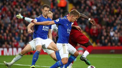 Mane is fouled by Marc Albrighton of Leicester City. A penalty was later awarded. Getty