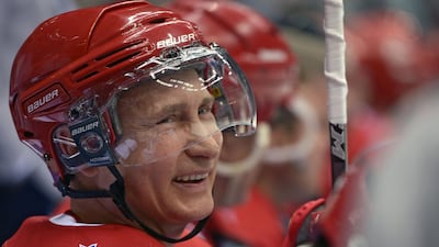 Putin smiles during an ice hockey match as part of the Night Hockey league tournament in Sochi on May 16, 2015. AFP