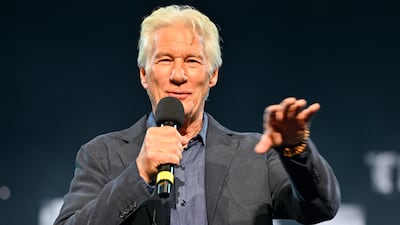 Richard Gere speaks during the concert. The event was billed as 'a gathering of artists, musicians and people for whom silence feels impossible'. WireImage
