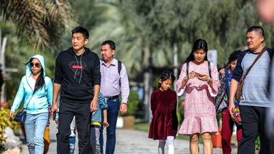 Chinese tourists enjoying the Abu Dhabi sights at the UAE Heritage Village. Victor Besa / The National