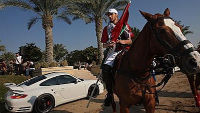 Tariq al Habtoor gets ready to play for the UAE team in a charity match against a Palestinian side at the Dubai Polo and Equestrian Club yesterday. The UAE won by five and a half points to five.