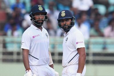 Rohit Sharma, right, scored his second century of the Visakhapatnam Test. AFP