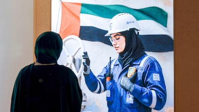 The role of Emirati women is celebrated at an Adnoc event, at the Abu Dhabi Energy Centre. Victor Besa / The National