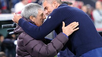 Barcelona manager Quique Setien, left, hugs Athletic Bilbao counterpart Gaizka Garitano. AFP