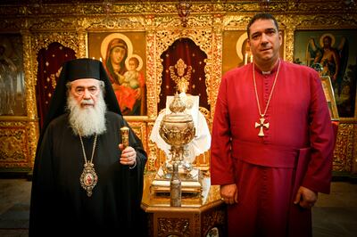 Patriarch of Jerusalem Theophilos III and the Most Reverend Dr Hosam Elias Naoum with the silver urn containing the chrism oil. Photo: Patriarchate of Jerusalem / Buckingham Palace