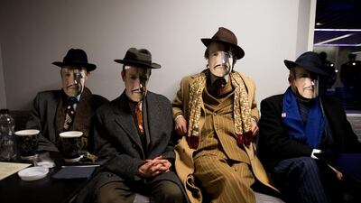 People wearing a David Cameron masks during the Grassroots out public meeting in London. Grass roots Out, or GO for short, is made up of politicians and supporters from across the political spectrum, with a single aim: to get the United Kingdom out of the European Union. Cameron is hoping to get a deal on EU reform at the EU Summit as talks continue into the night. Andrew Cowie / EPA