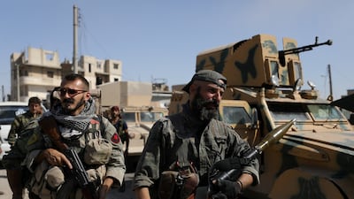 Syrian Democratic Forces fighters in Raqqa, Syria. Photo: Reuters