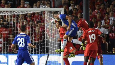 Defender Gary Cahill of Chelsea heads the ball to score during their International Champions Cup against Liverpool. Mark Ralston / AFP