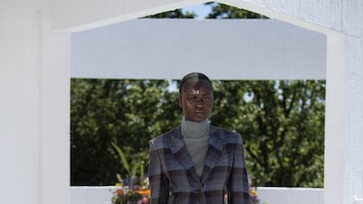 A subtly checked polo neck is worn under a bold checked suit at Qasimi spring / summer 2022. Courtesy Qasimi