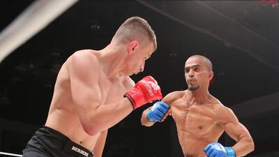 The UAE’s Ahmad Al Darmaki, in white shorts, fights with Artiyom Gorodynets from Ukraine in the Abu Dhabi Warriors 4 at IPIC Arena in Zayed Sports city in Abu Dhabi. Ravindranath K / The National
