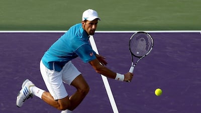 Novak Djokovic of Serbia returns a shot to Joao Sousa of Portugal during the Miami Open presented by Itau at Crandon Park Tennis Center on March 27, 2016 in Key Biscayne, Florida. Matthew Stockman/Getty Images/AFP