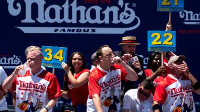 Mr Chestnut ate 63 hot dogs to win the men's division of the contest. AP