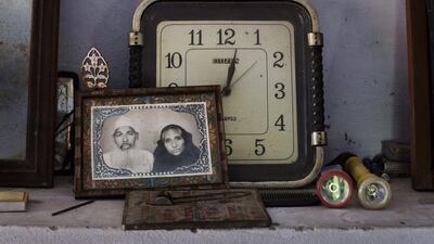 A portrait of retired postman Faizul Hasan Qadri and his late wife Tajammuli inside Mr Qadri’s house. The couple were married for 58 years.