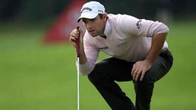 Oliver Wilson of England on the par four 18th green during the third round of the HSBC Champions at Sheshan Golf Club.