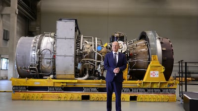 Mr Scholz in August with a Siemens gas turbine intended for the Nord Stream 1 gas pipeline in Russia. Getty Images