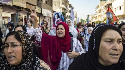 Syrian Kurds demonstrate against the Turkish assault against northeastern Syria, in the town of Qamishli. AFP