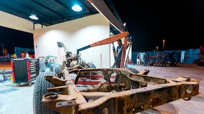 A frame and wheels await the rest of the car