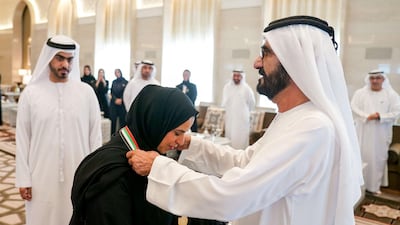 Sheikh Mohammed bin Rashid, Prime Minister and Ruler of Dubai, honours Sheikha Al Nuaimi with the Prime Minister's Award during a UAE Cabinet meeting on Sunday. Wam