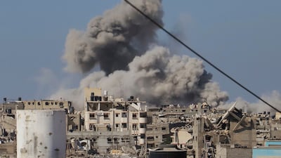 Smoke rises following an Israeli bombardment in Khan Younis, Gaza. AP