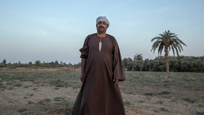 55-year-old Egyptian farmer Makhluf Abu Kassem stands on a land that was once fertile. AP