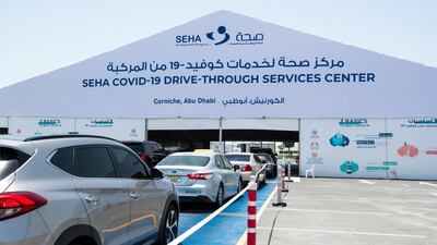 Cars queue at the drive-through testing and vaccination centre on Abu Dhabi's Corniche.