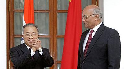 The Chinese state councillor Dai Bingguo, left, with the Indian national security adviser Shivshankar Menon in New Delhi yesterday.