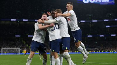 Tottenham Hotspur's Uruguayan midfielder Rodrigo Bentancur celebrates with teammates after scoring the winner. AFP