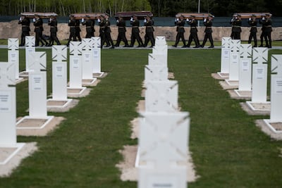 A mass funeral ceremony to bury 25 unidentified Ukrainian soldiers in Kyiv. Reuters