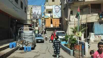 Inside Shatila refugee camp in Lebanon, where pictures of those killed during the conflict with Israel look over the streets. Kaveh Kazemi / Getty Images