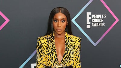 Jackie Aina, nominee for The Beauty Influencer of 2018, wears archetypal Versace. Photo / AFP