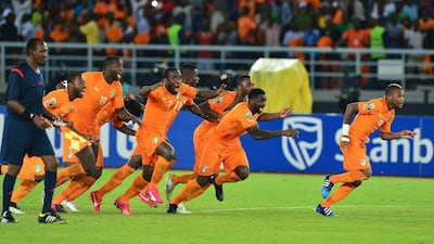 Ivory Coast players, from left to right, Siaka Tiene, Yaya Toure, Serey Doumbia, Kolo Toure and Serey Die react in celebration at the end of the penalty shootout win over Ghana in the Africa Cup of Nations final on Sunday. Gavin Barker / EPA