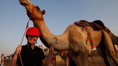 Sarah Collins from New Zealand celebrates after winning the first Female Camel Racing Series C1 Championship at Al Marmoom Camel Racing Track in Gulf emirate of Dubai, United Arab Emirate, 22 October 2021. Eight female participants took part in the race, seven of them got a training riding course at the school of Arabian Desert Camel Riding Centre (ADCRC) which is the first of its kind in the region, the first center dedicated to teaching camel riding and especially for women. EPA / ALI HAIDER