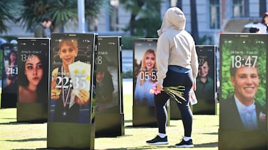 Images of children who lost their lives due to online harm are displayed at an art installation in Los Angeles, California. AFP