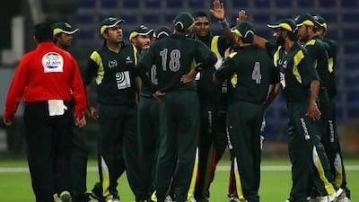 The NMC players celebrate the dismissal of a wicket in their Ramadan Cup game against Danube at the Zayed Cricket Stadium. Satish Kumar / The National