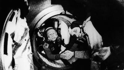 Soviet commander of the Soyuz 19 space mission, Alexei Leonov, left, grasps the hand of American commander of the Apollo 18, Thomas Stafford in July 1975, after docking manoeuvres of the first joint US-Soviet space flight. AFP