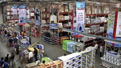 Indian people shop at a Bharti-Walmart store on the outskirts of Chandigarh, India. Despite opposition, the Indian government has decided to open the country’s retail sector to multinationals.