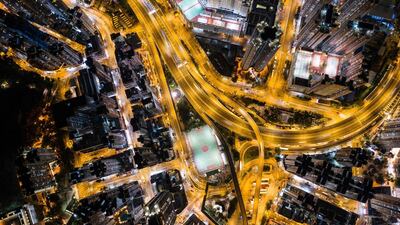 Commercial and residential buildings in Hong Kong at night.