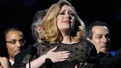 Adele accepts Album of the Year for "21" at the 54th annual Grammy Awards. Mario Anzuoni / Reuters