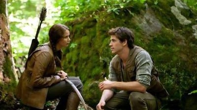 Katniss Everdeen (Jennifer Lawrence) and Gale Hawthorne (Liam Hemsworth) in THE HUNGER GAMES.