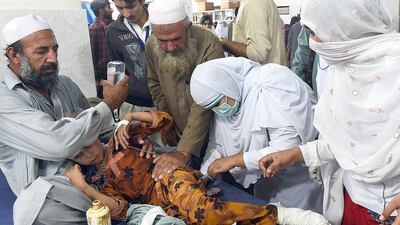 A girl injured in the South Asia earthquake is treated at a hospital in Peshawar, Pakistan. A Majeed / AFP Photo