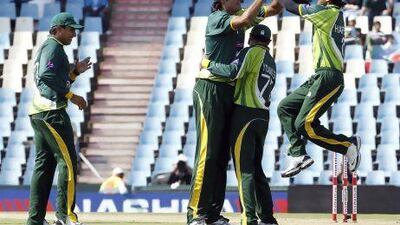 Pakistan players celebrate the dismissal of South Africa's Hashim Amla.