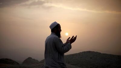 A Muslim pilgrim prays atop Mount Thor in the holy city of Mecca ahead of the annual Haj pilgrimage . Ibraheem Abu Mustafa / Reuters