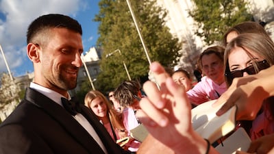 Novak Djokovic signs autographs as he attends the 2024 Laureus World Sports Awards in Madrid. Getty