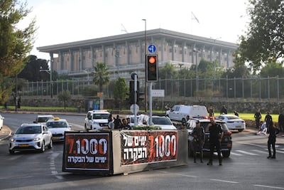 Protesters stage a demonstration outside Israel's parliament on July 2 to mark 1,000 days since the deadly Hamas-led attacks of October 7, 2023. Reuters
