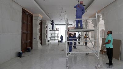 Ongoing interior work. Fragrant white jasmine shrubs and frangipani trees are being planted in green areas outside the temple.