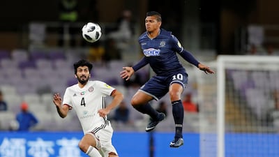 Ryan De Vries in action with Al Jazira’s Mohammed Ali Ayed. Reuters