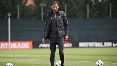 Juventus coach Massimiliano Allegri takes part in a training session on the eve of their Uefa Champions League semifinal against Real Madrid on May 4, 2015 near Turin. AFP PHOTO / MARCO BERTORELLO