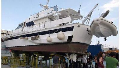 Activists examine the bent propeller of a vessel, scheduled to take part in the "Free Gaza" flotilla at a dry dock in Greece. Andreas Papaconstantinou / EPA
