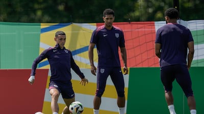 England's Phil Foden alongside Jude Bellingham. AP